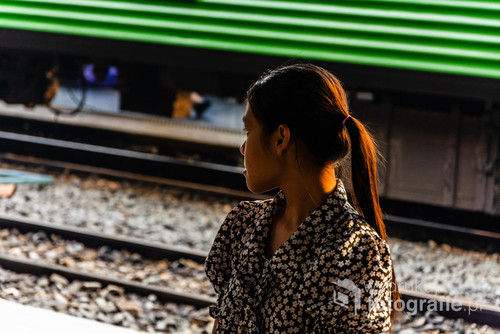 Young woman on a train station, Bangkok, Thailand
