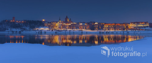 Zdjęcie przedstawia Panoramę Grudziądza zimą 