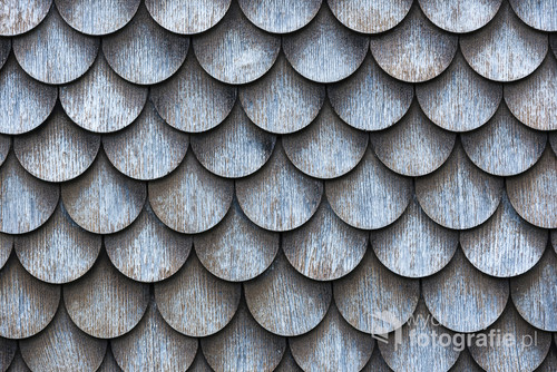 The wall covered with wooden shingles - wooden background horizontal.
